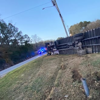 Investigators said they believe a driver fell asleep at the wheel, left the roadway and rolled a box truck, according to the Georgia State Patrol. The driver survived. (Georgia Department of Public Safety)