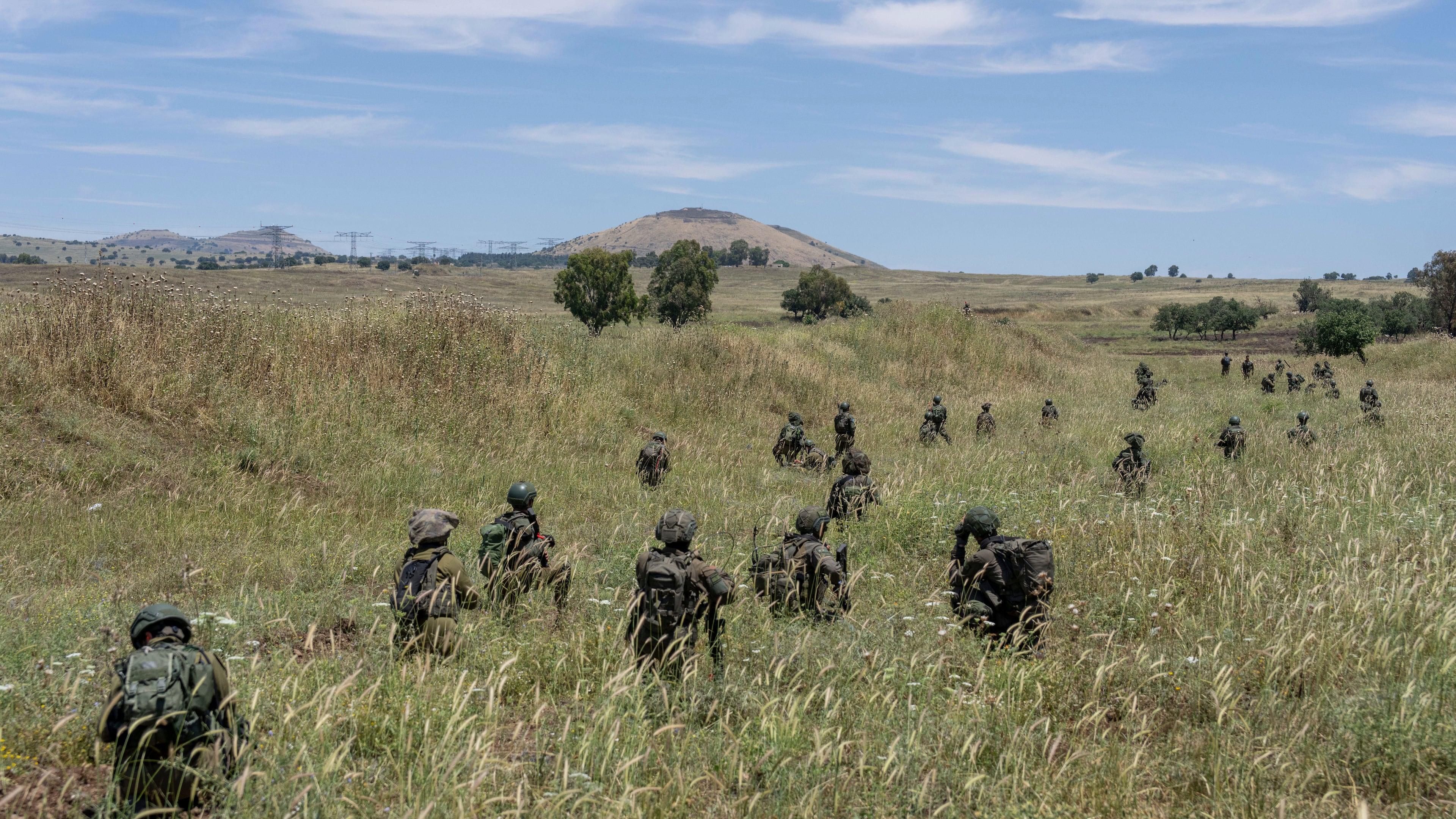 FILE - Israeli combat reservists take position during training in the Israeli-controlled Golan Heights on May 8, 2024. (AP Photo/Ohad Zwigenberg, File)