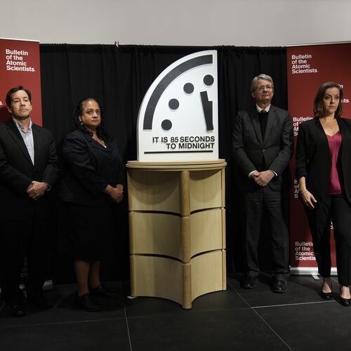 The Bulletin of the Atomic Scientist members, from left, Jon B. Wolfsthal, Asha M. George, Steve Fetter and Alexandra Bell, reveal the Doomsday Clock, set to 85 seconds to midnight, during a news conference at the Carnegie Endowment for International Peace, Friday, Jan. 23, 2026, in Washington. (AP Photo/Pablo Martinez Monsivais)