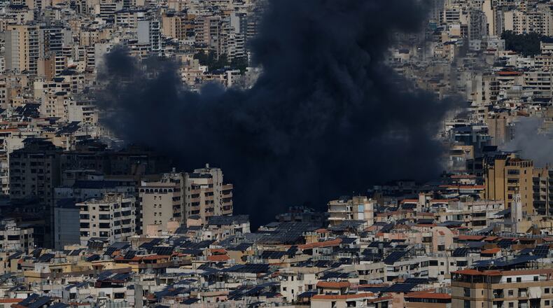 Smoke rises following an Israeli airstrike in Dahiyeh, Beirut's southern suburbs, Lebanon, Monday, March 9, 2026. (AP Photo/Bilal Hussein)