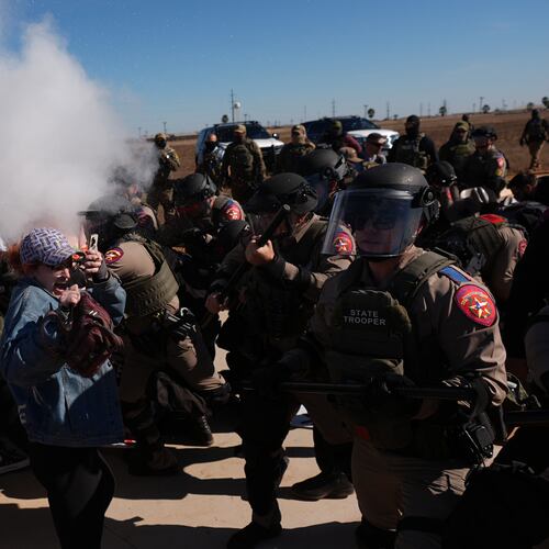 Pepper spray is used by Texas troopers to disperse protesters outside the South Texas Family Residential Center detention facility where Liam Ramos and his father are being detained in Dilley, Texas, Wednesday, Jan. 28, 2026. (AP Photo/Eric Gay)