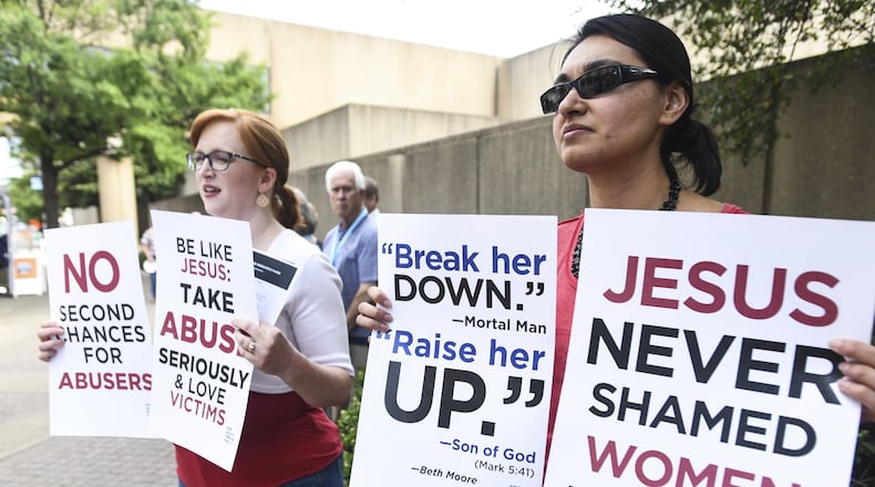 Jennifer Weed (left) and Nisha Virani, both of Birmingham, Ala., demonstrate outside the Southern Baptist Convention’s annual meeting Tuesday, June 11, 2019, during a rally in Birmingham. The For Such a Time As This protest calls for a change in the way the SBC views and treats women and demands action to combat sexual abuse within the establishment. AP PHOTO / JULIE BENNETT