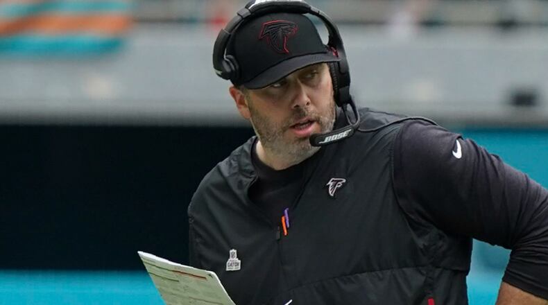 Falcons head coach Arthur Smith walks on the field to challenge a play during the second half against the Miami Dolphins, Sunday, Oct. 24, 2021, in Miami Gardens, Fla. (Hans Deryk/AP)