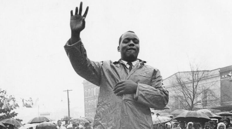 Lonnie King addresses thousands of demonstrators in Atlanta in a group prayer before a protest against retail shops on Dec. 12, 1960. MANDATORY CREDIT: The Atlanta Journal-Constitution Photographic Archives. Special Collections and Archives, Georgia State University Library