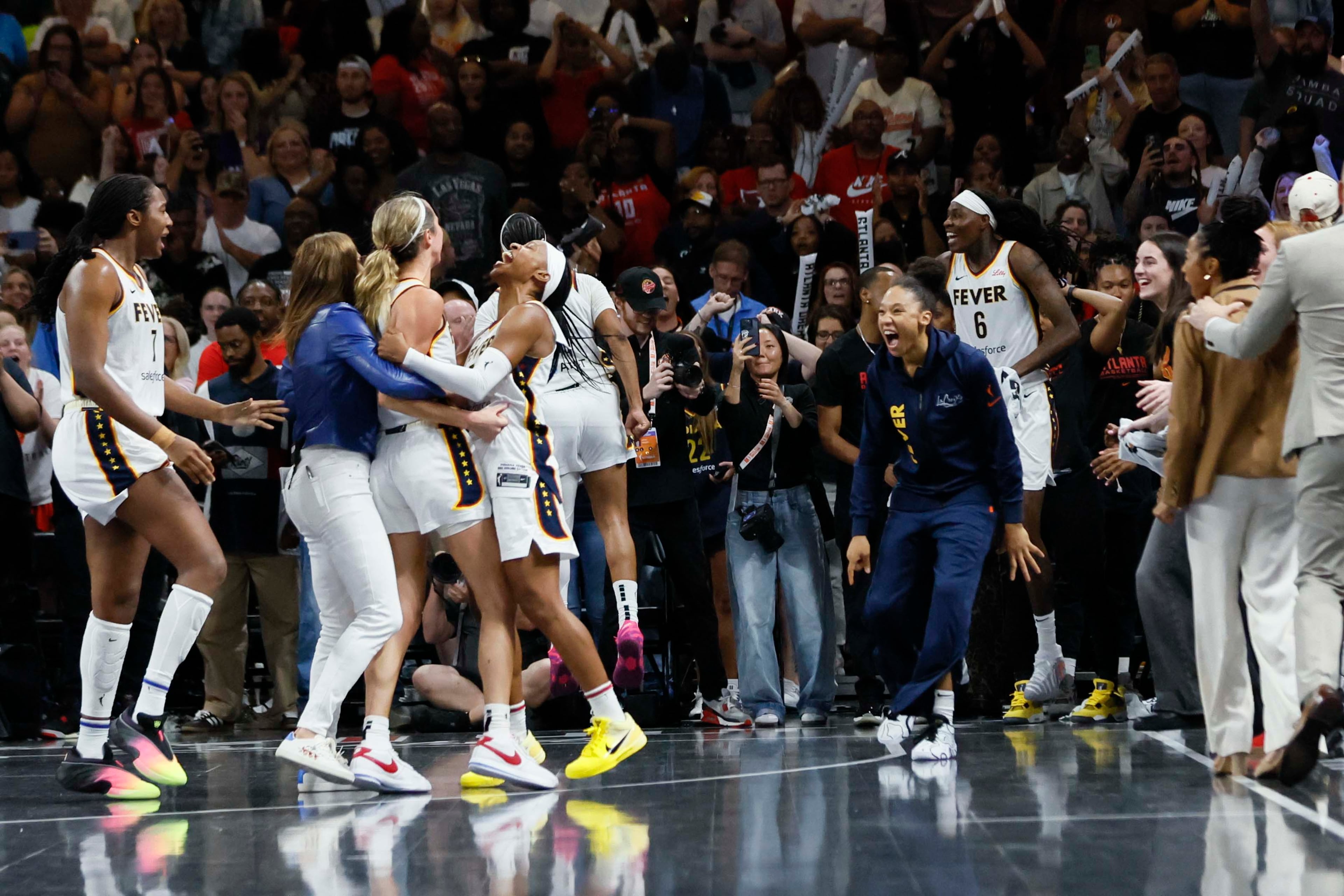 Indiana Fever players celebrate after defeating the Atlanta Dream 87-85 to advance to the next round at Gateway Center Arena on Thursday, Sept. 18, 2024, in Atlanta. The Atlanta Dream lost 87-85. (Miguel Martinez/ AJC)