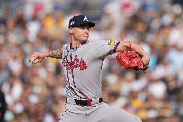 Atlanta Braves starting pitcher AJ Smith-Shawver works against a San Diego Padres batter during the first inning of a baseball game Sunday, March 30, 2025, in San Diego. (AP Photo/Gregory Bull)