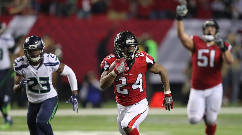 January 14, 2017, Atlanta: Falcons running back Devonta Freeman picks up a long gain against Seahawks Steven Terrell during the second half in a NFL football NFC divisional playoff game on Saturday, Jan. 14, 2017, in Atlanta. Curtis Compton/ccompton@ajc.com
