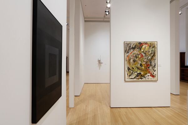 Left to right: “Untitled (Black Painting)” by Felrath Hines; “Watching Shadows Dancing IV” by Kevin Cole (on rear wall); “Prelude to a Kiss” by Alexander S. McMath.