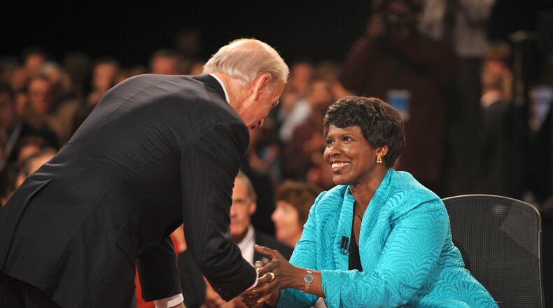 FILE - In this Oct. 2, 2008, file photo, PBS journalist and debate moderator Gwen Ifill and then-Democratic vice presidential nominee, Sen. Joe Biden, D-Del., left, shake hands at the end of his vice presidential debate with Republican rival, Alaska Gov. Sarah Palin in St. Louis, Mo. Ifill died on Monday, Nov. 14, 2016, of cancer, PBS said. She was 61. (AP Photo/Don Emmert, File Pool)