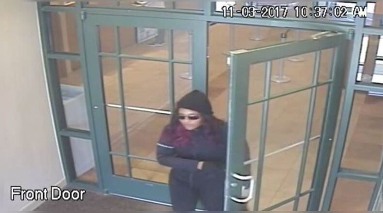 The woman on bank surveillance video is believed to be connected to several metro Atlanta bank robberies, the FBI said Friday.