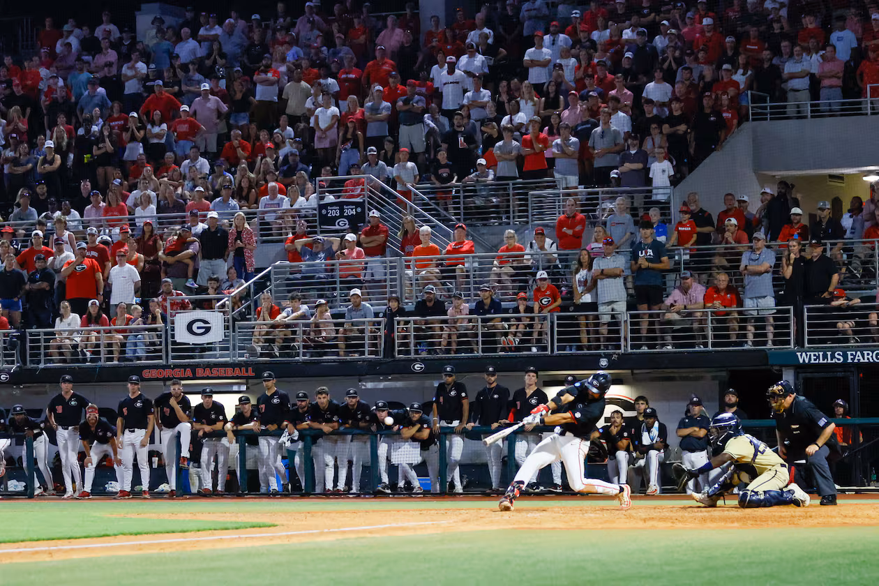 Georgia first baseman Corey Collins hits a two-run RBI double in the 10th inning against Georgia Tech during an NCAA Regional game in Athens in 2024. In a matchup of top 10 teams, the seventh-ranked Bulldogs defeated the third-ranked Yellow Jackets in two straight games to advance to the College World Series. (Miguel Martinez/AJC 2024)
