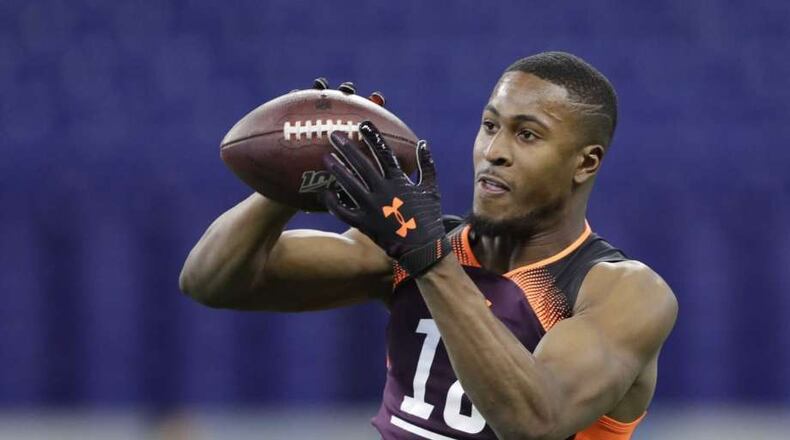 Houston cornerback Isaiah Johnson, an unpolished cornerback prospect, is a projected third-round pick. Here catching a ball at the NFL scouting combine. (Darron Cummings, Associated Press )