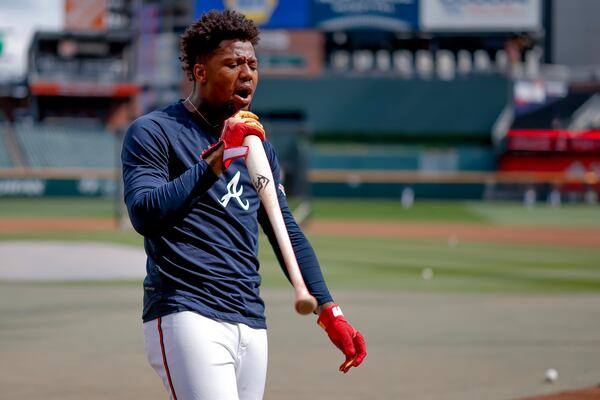 Braves right fielder Ronald Acuña Jr. belts a pregame tune on Tuesday. (Erik S. Lesser/AP)
