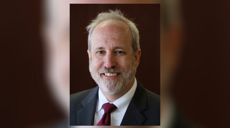 Stefan Ritter, the executive director of the state ethics commission, was suspended with pay Tuesday. An investigation will look into whether he misused his computer.
