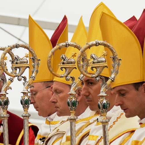 Newly consecrated Bishops, from left, Pascal Schreiber, Michael Goldade, Michel Poinsinet de Sivry and Marc Hanappier, wearing their miters and holding their pastoral staffs, pray at the end of their consecration ceremony in a tent set up outside the Society of St. Pius X seminary in Econe, Switzerland, Wednesday, July 1, 2026. (AP Photo/Baz Ratner)