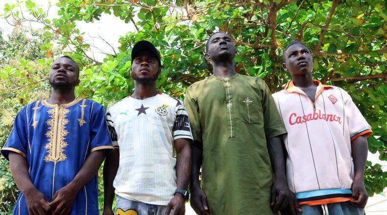 Mubarak Dahiru, second left, and friends who survived while in detention by NSCDC officials are photographed in Minna, Nigeria, Saturday, Sept. 19, 2026. (AP Photo/Afolabi Sotunde)