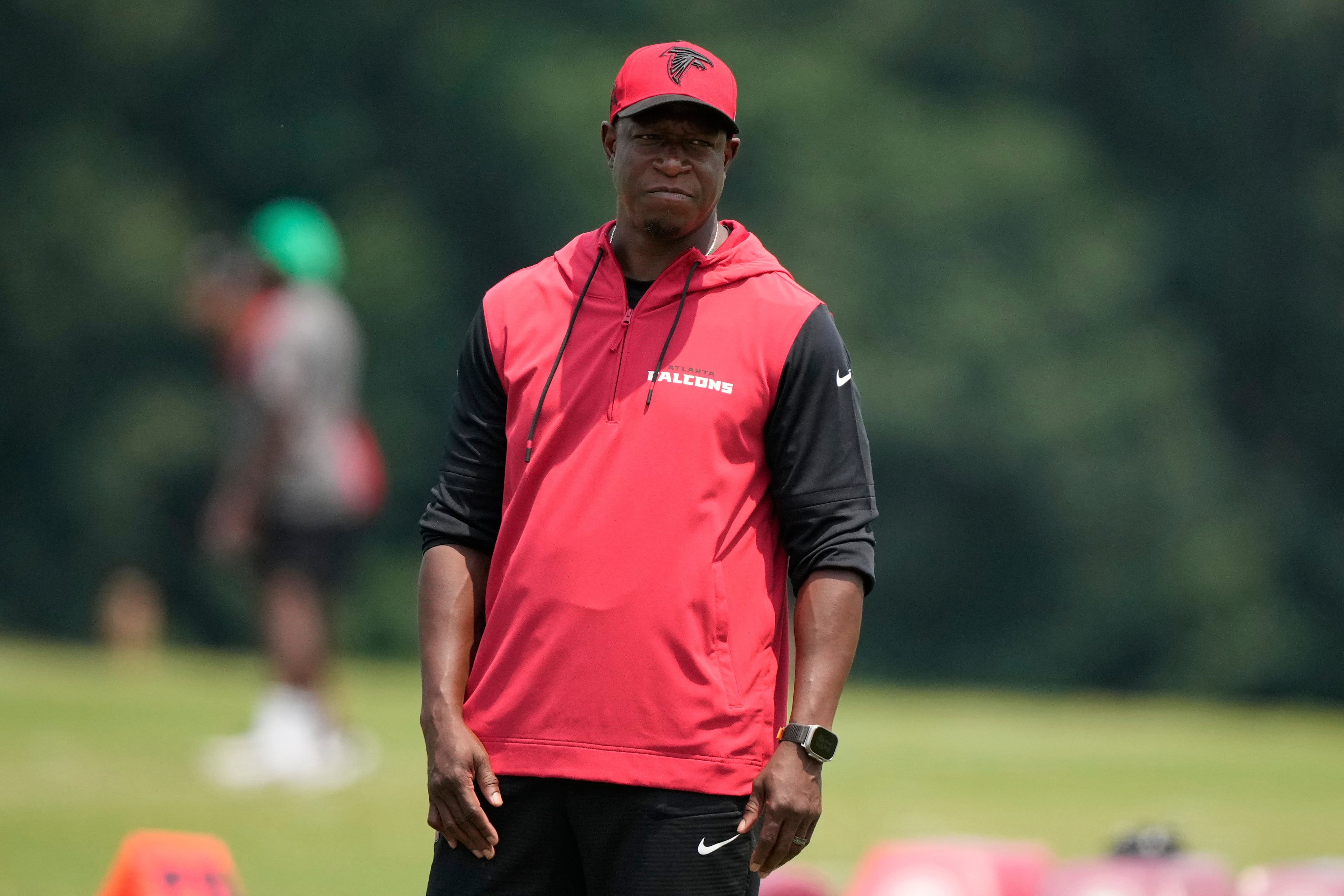 Atlanta Falcons head coach Raheem Morris talks to coaches during an NFL football training camp on Monday, June 2, 2025, in Flowery Branch, Ga. (AP Photo/Brynn Anderson)