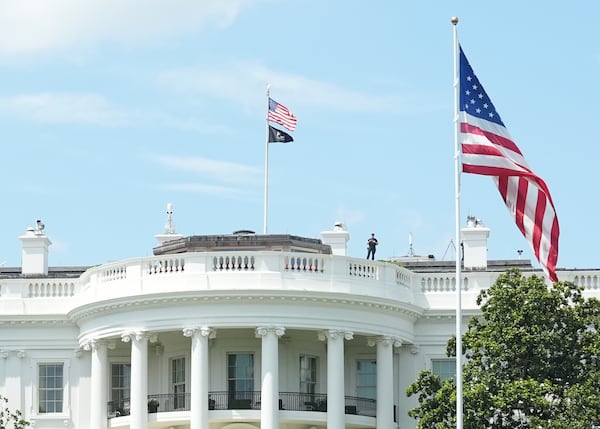 A member of the U.S. Secret Service looks on as President Donald Trump returns to the White House from Trump National Golf Club, June 29, 2025, in Washington. (AP Photo/Jacquelyn Martin)