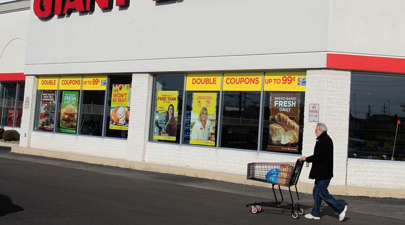 FILE - A man walks out of the Giant Eagle grocery store Thursday, Nov. 17, 2011, in Mayfield Heights, Ohio. (AP Photo/Tony Dejak, File)
