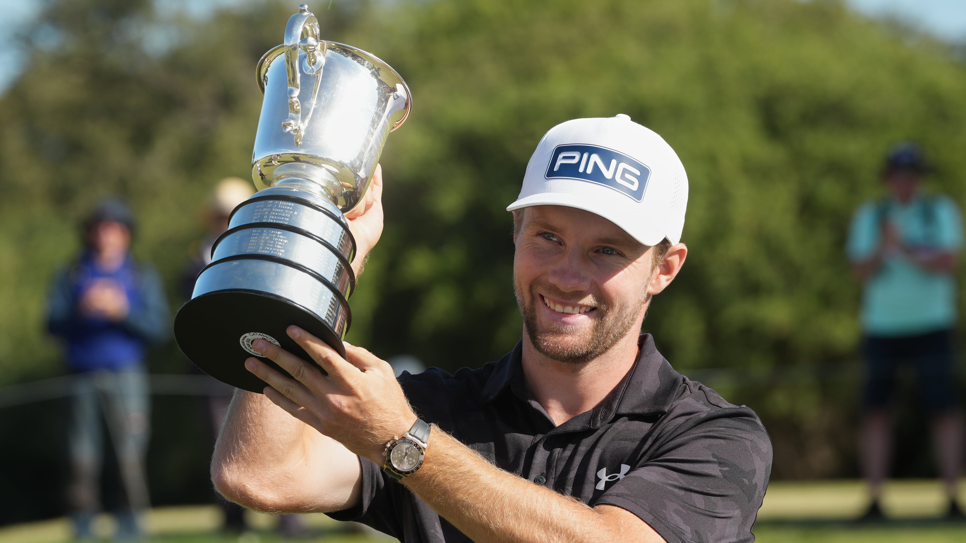 Denmark's Rasmus Neergaard-Petersen holds the Stonehaven Cup after winning the Australian Open golf tournament in Melbourne, Australia, Sunday, Dec. 7, 2025. (AP Photo/Asanka Brendon Ratnayake)