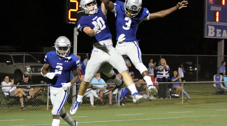 No. 3 Jermaine Brewton and No. 10 Luke Bennett celebrating.