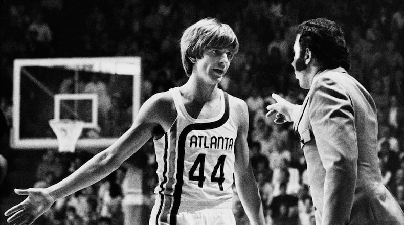 Before making his debut into professional basketball, “Pistol” Pete Maravich receives last minute instructions from coach Richie Guerin, in Atlanta, Oct. 20, 1970. (AP Photo/Toby Massey)