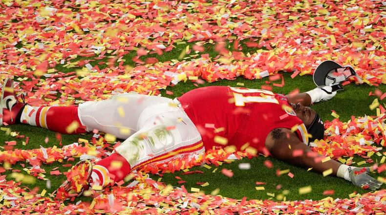 Kansas City Chiefs' Derrick Nnadi (91) plays with the confetti, at the end of the NFL Super Bowl 54 football game against the San Francisco 49ers, Sunday, Feb. 2, 2020, in Miami Gardens, Fla. The Chiefs' defeated the 49ers 31-20.