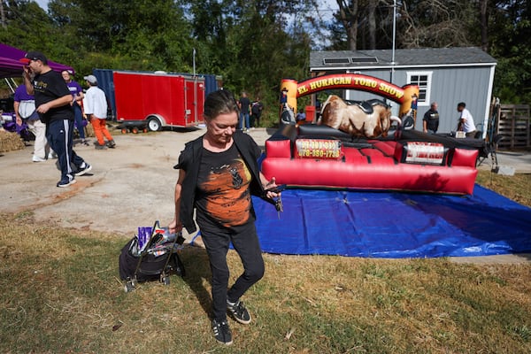 Tucker resident Amy Bielawski, who runs Hare-Brained Productions, prepares to work at a fall festival.