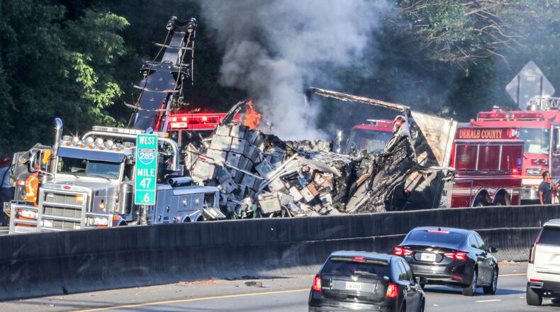 June 20, 2022 Dekalb County: Two predawn crashes made a mess of things Monday, June 20, 2022 on I-285 in DeKalb County, shutting down both the inner and outer loops for hours during the morning commute. Two eastbound lanes of I-285 at Flat Shoals Parkway remained closed at 9:30 a.m., according to the WSB 24-hour Traffic Center. All lanes were closed around 4:45 a.m., when the big rig was involved in a multivehicle wreck and burst into flames. According to DeKalb police, the tractor-trailer’s brakes went out and it hit two unoccupied, abandoned vehicles after pulling into an emergency lane. One of the empty vehicles also caught fire, but no one was injured, a police spokesperson said. The flames have since been extinguished, but a crash investigation is ongoing. On the inner loop, traffic was backed up for miles behind another wreck at Glenwood Road. A pedestrian was hit and killed, and the driver involved stayed at the scene, police said. All southbound lanes were closed at 5:30 a.m. and started reopening two hours later. (John Spink / John.Spink@ajc.com)