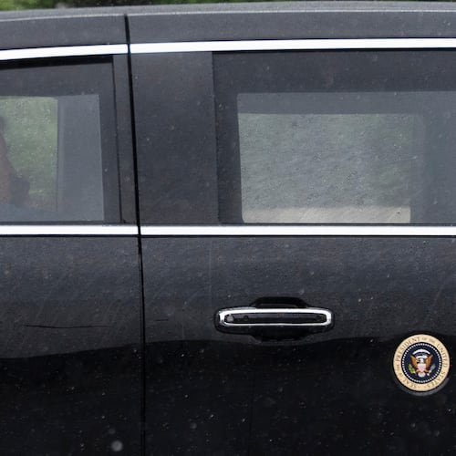 President Donald Trump sits at the back of the presidential limousine as it drives outside the Walter Reed National Military Medical Center from the White House, Tuesday, May 15, 2026 in Bethesda, Md. (AP Photo/Manuel Balce Ceneta)