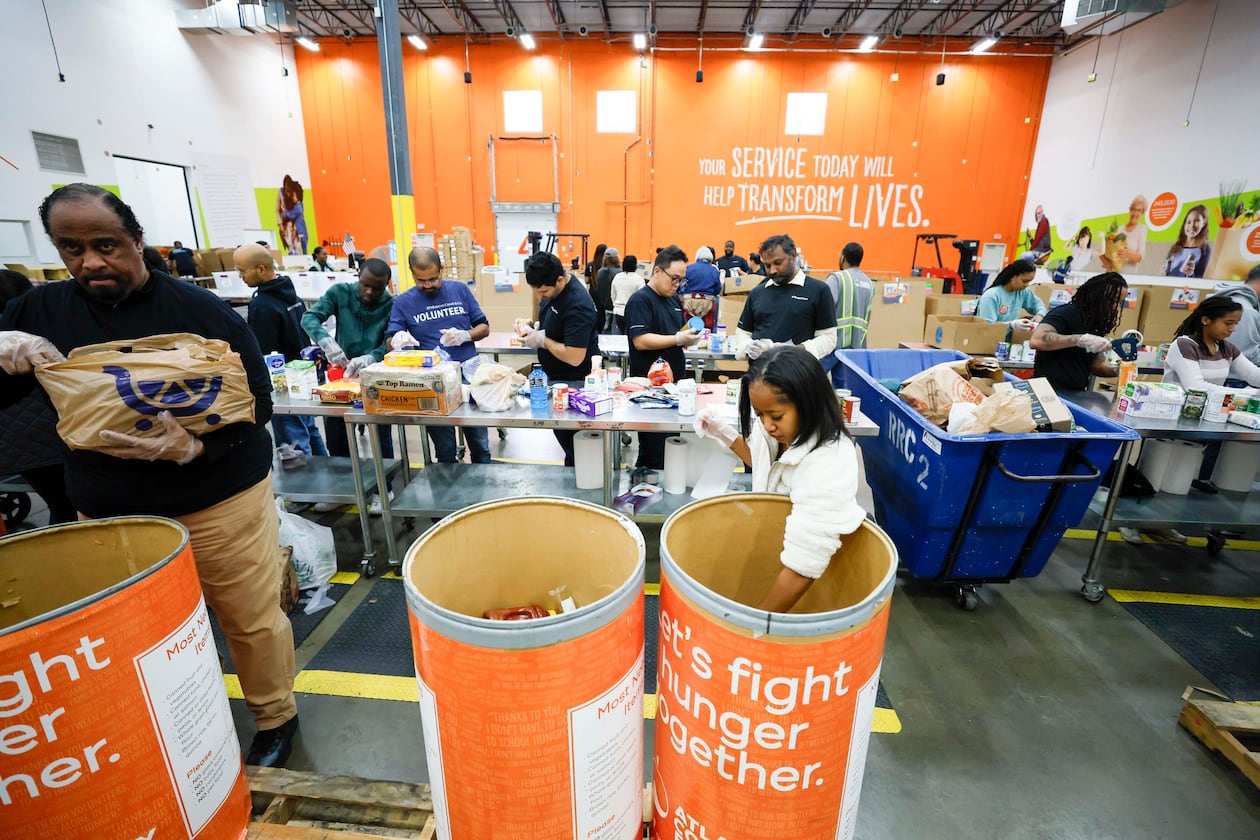 Volunteers packed food at the Hunger Action Center at the Atlanta Community Food Bank Distribution Center this week.