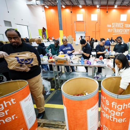 Volunteers packed food at the Hunger Action Center at the Atlanta Community Food Bank Distribution Center this week.