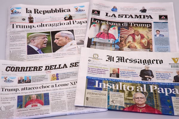Recent front pages of some Italian newspapers report on comments made by U.S. President Donald Trump about Pope Leo XIV, with headlines using words such as “outrage,” “shock attack,” “insult” and “Trump’s schism.” (Domenico Stinellis/AP)