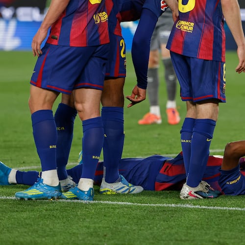 Barcelona's Lamine Yamal lies on the pitch in pain during the Spanish La Liga soccer match between Barcelona and Celta Vigo in Barcelona, Spain, Wednesday, April 22, 2026. (AP Photo/Joan Monfort)