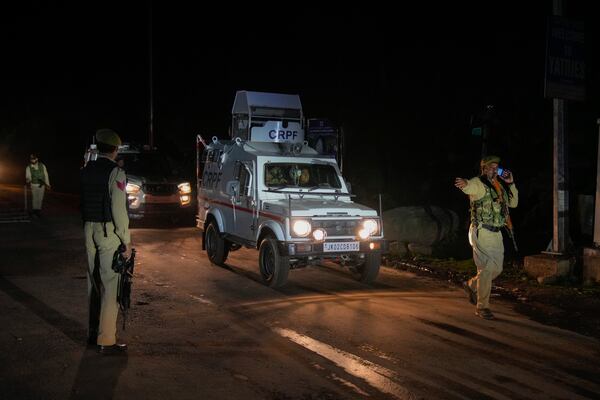 Indian police officers stands guard at a check point near Pahalgam in south Kashmir after assailants indiscriminately opened fired at tourists visiting Pahalgam, Indian controlled Kashmir, Tuesday, April 22, 2025.(AP Photo/Dar Yasin)