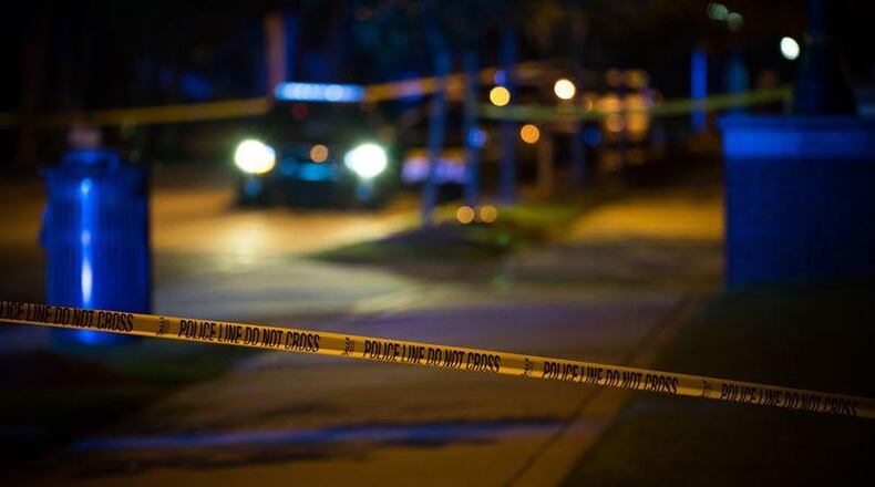 Police in Sandy Springs are still searching for two men who robbed a woman after following her home from a McDonald’s