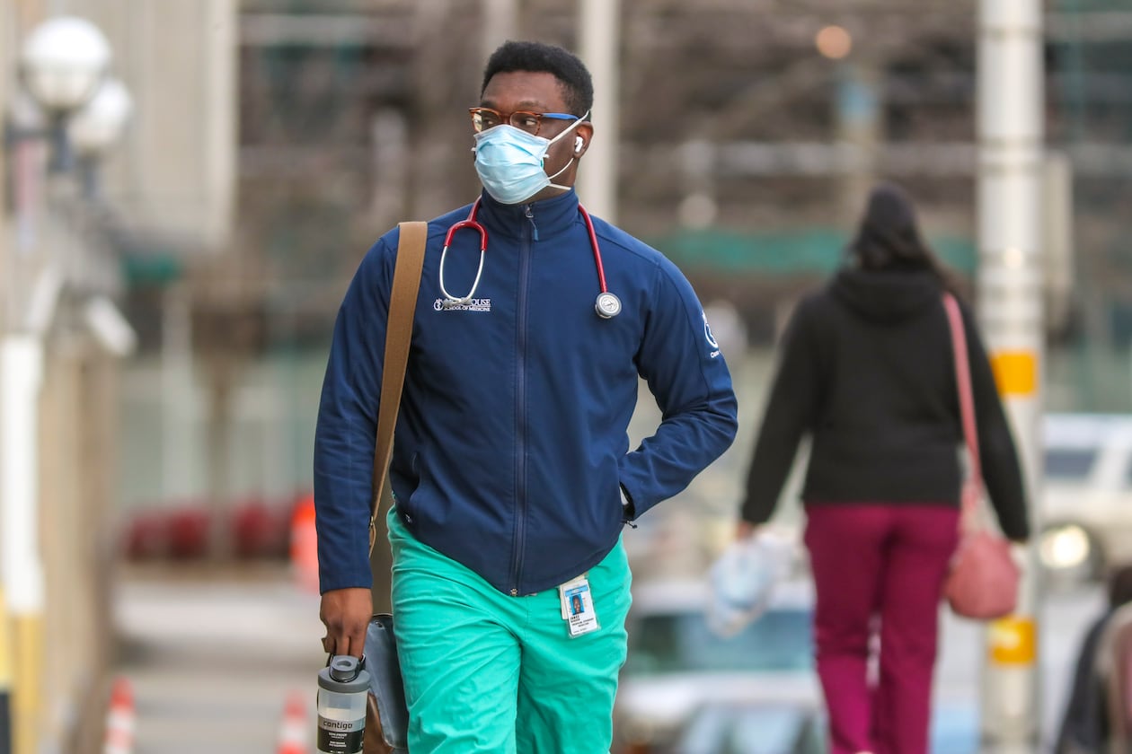 A Morehouse School of Medicine student walks to Grady Memorial Hospital on Feb. 2, 2021. (John Spink/AJC)