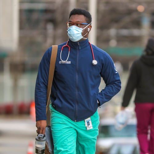 A Morehouse School of Medicine student walks to Grady Memorial Hospital on Feb. 2, 2021. (John Spink/AJC)
