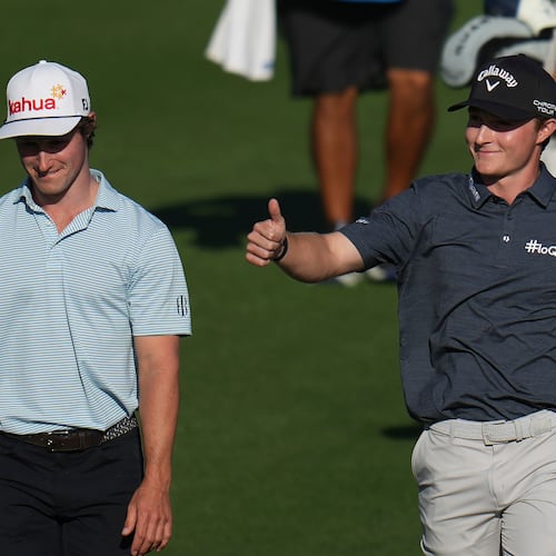 Blades Brown, right, reacts for a cheering gallery as he walks with David Ford as the gallery cheers for Brown who finished with a 12-under-par 60 during the second round of the American Express golf event at the Jack Nicklaus Tournament Course at PGA West Friday, Jan. 23, 2026, in La Quinta, Calif. (AP Photo/Ross D. Franklin)