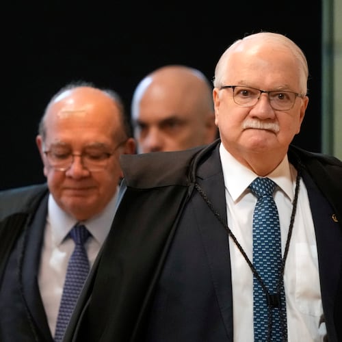 Supreme Court President Justice Edson Fachin, front, arrives to preside over a plenary session of the court in Brasilia, Brazil, Wednesday, Sept. 2, 2026. (AP Photo/Eraldo Peres)
