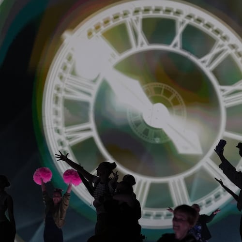 FILE - Performers celebrate the Glasgow Central railway station clock during the Commonwealth Games opening ceremony in Glasgow, Scotland, July 23, 2026. (AP Photo/Kin Cheung, File)