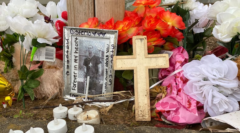 A memorial to Jatonne Sterling, a Clark Atlanta University student who was fatally shot Feb. 28, is located in the parking lot near campus where the incident took place. Three weeks after his death, students continue to stop by, leaving flowers and other tributes. (Vanessa McCray / vanessa.mccray@ajc.com)