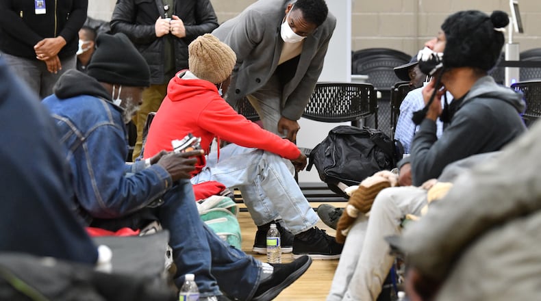 December 22, 2022 Atlanta - Atlanta mayor Andre Dickens talks to clients as he visits the Old Adamsville Recreation Center warming center in Atlanta on Thursday, December 22, 2022. The City of Atlanta recently announced to open multiple warming centers as temperatures drop across metro Atlanta. (Hyosub Shin / Hyosub.Shin@ajc.com)