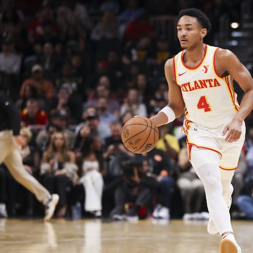 Kobe Bufkin, who scored 14 points in the Hawks' 92-88 win over the Grizzlies in a Summer League game on Thursday, dribbles up the court during a game last season. (Jason Getz/AJC)