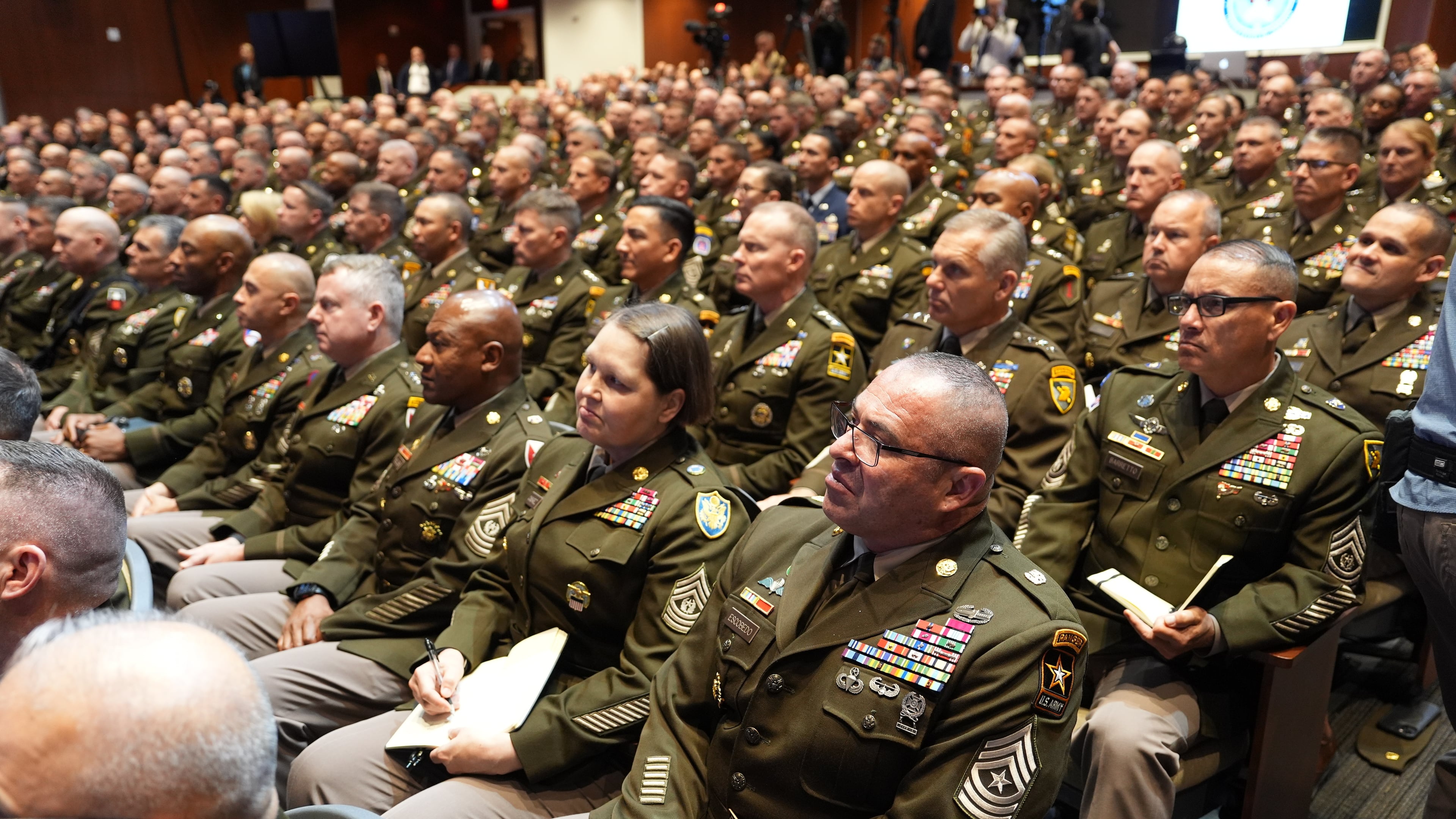U.S. military senior leadership listen as President Donald Trump speaks at Marine Corps Base Quantico, Tuesday, Sept. 30, 2025 in Quantico, Va. (AP Photo/Evan Vucci)