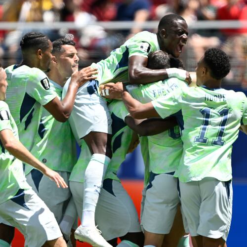 Switzerland's Breel Embolo is mobbed by teammates after scoring the opening goal from the penalty spot during the World Cup Group B soccer match between Qatar and Switzerland in Santa Clara, Calif., near San Francisco, Saturday, June 13, 2026. (AP Photo/Eakin Howard)