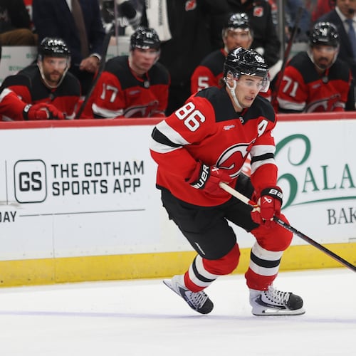 New Jersey Devils' Jack Hughes skates with the puck during the second period of an NHL hockey game against the Colorado Avalanche, Sunday, Oct. 26, 2025, in Newark, N.J. (AP Photo/Pamela Smith)