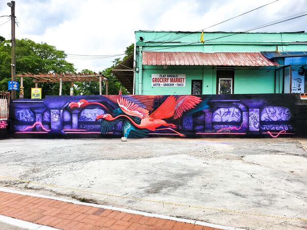 Two whimsical pink flamingos created by muralist and graffiti writer Matt Letrs fly through a representation of Atlanta’s Krog Street graffiti tunnel.