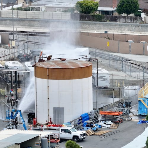 Water is sprayed on a tank that overheated at an aerospace plant in Garden Grove, Calif., Friday, May 22, 2026. (Jeff Gritchen/The Orange County Register via AP)