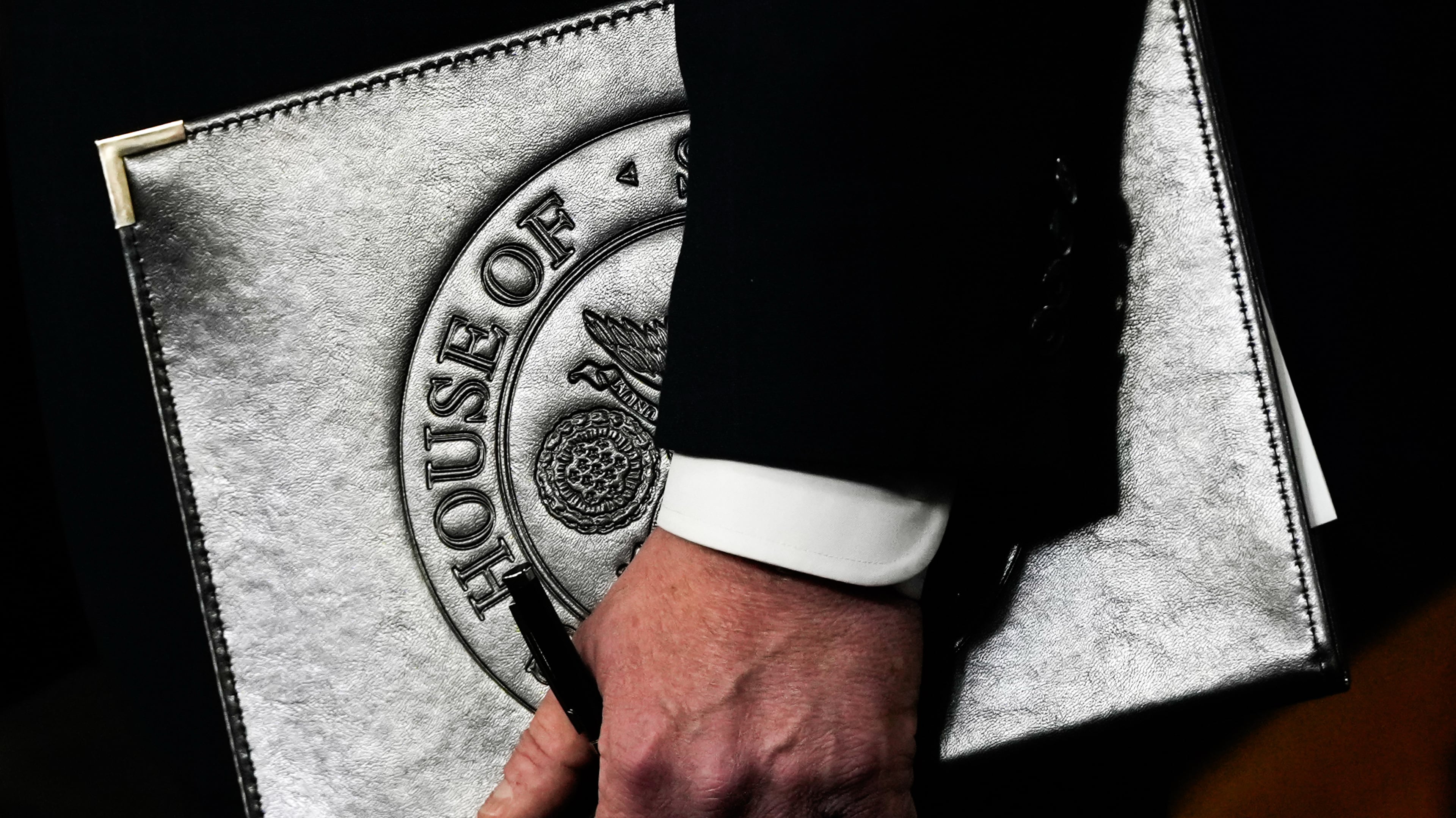 Speaker of the House Mike Johnson, R-La., holds a folder during a news conference on the Epstein Files Transparency Act, Tuesday, Nov. 18, 2025, at the U.S. Capitol in Washington. (AP Photo/Julia Demaree Nikhinson)